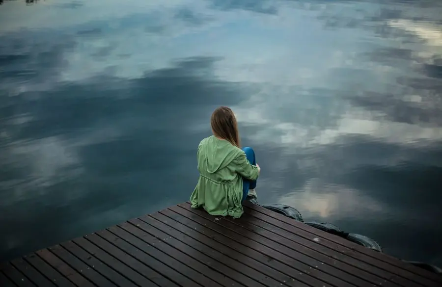 A quiet moment of reflection beside a calm lake