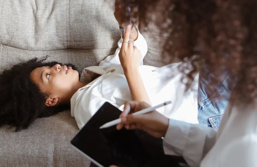 A patient speaking with a mental-health professional